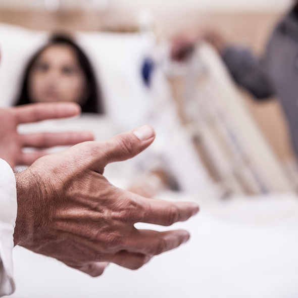 MD hands at bedside